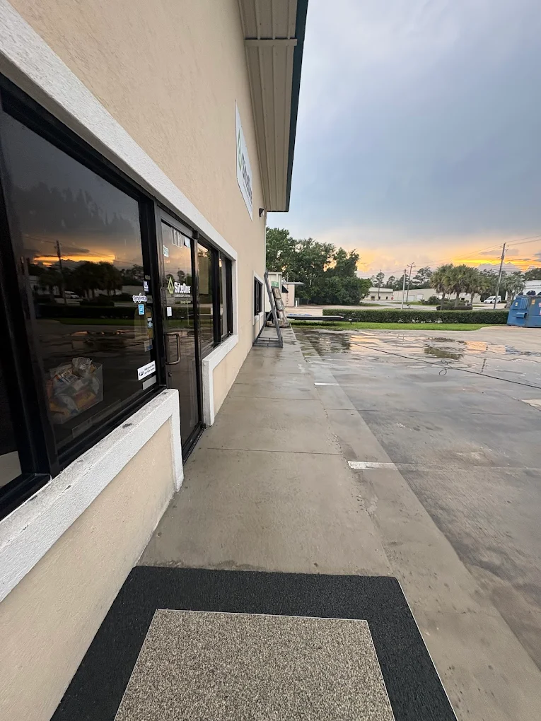 Clean commercial sidewalk after wash