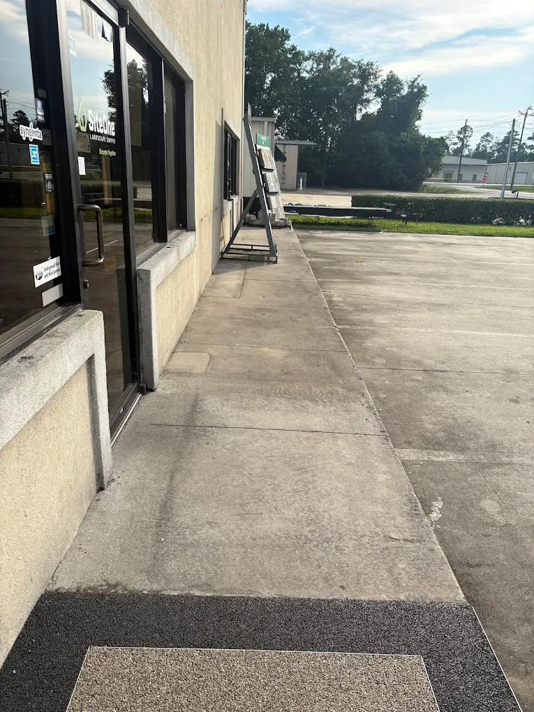 Dirty commercial sidewalk before wash